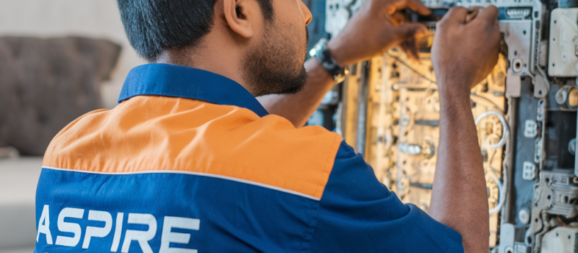 Aspire services technician wearinf Blue color Uniform and Repairing LED TV Display Strrips