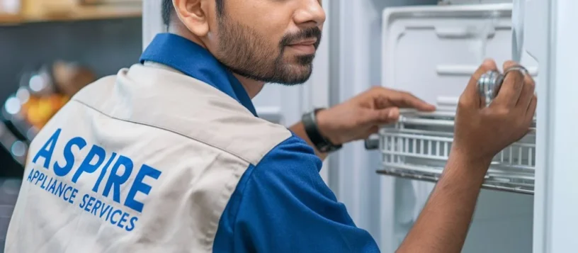 Aspire Services technician Checking Refrigerator Freezer